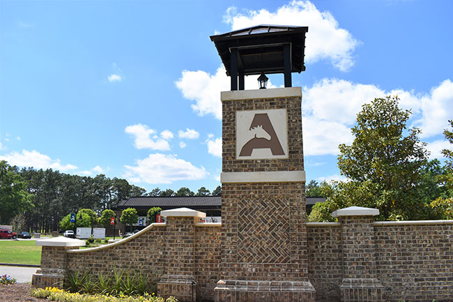 USC Aiken front entrance brick wall and gate